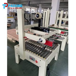 Máy dán băng dính thùng carton MDT123